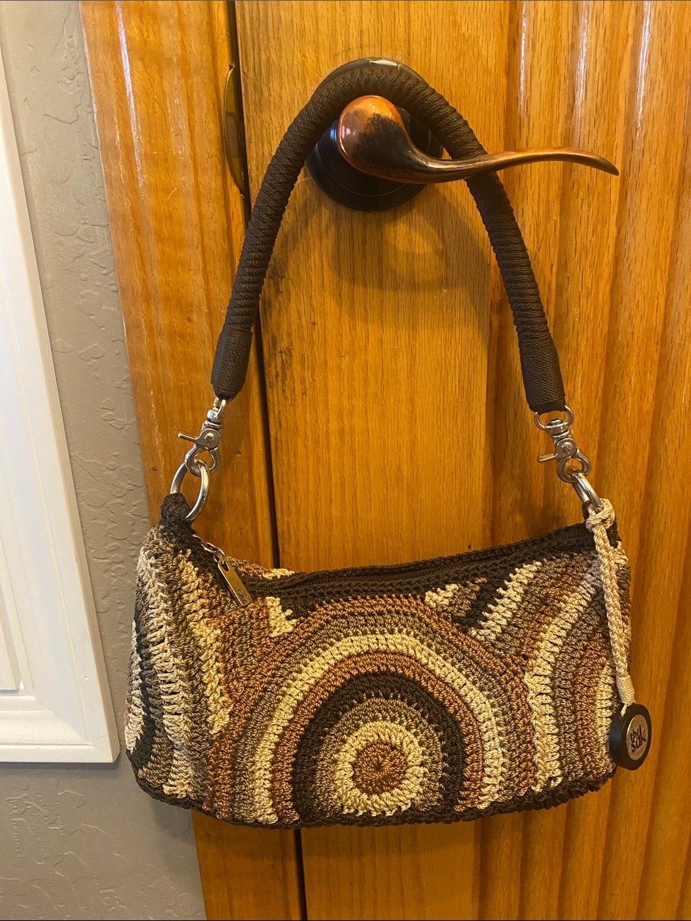 The Sak Mini Crocheted Shoulder bag with rope strap and silver hardware